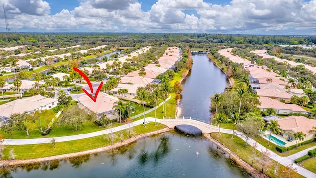 birds eye view of property with a water view