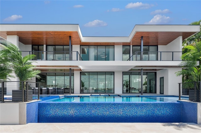 rear view of house with a balcony