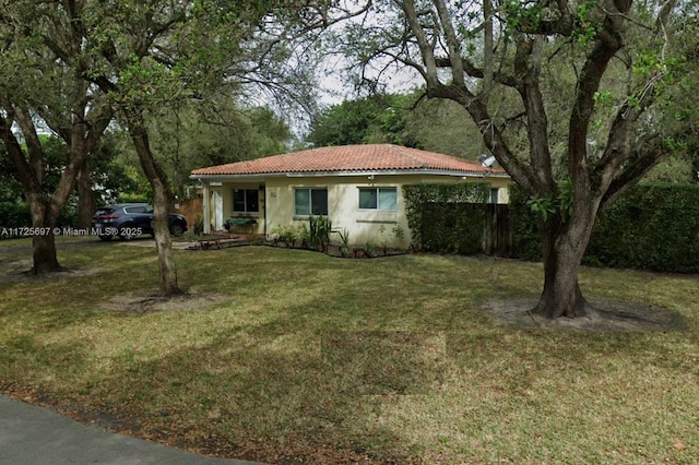 ranch-style house with a front yard