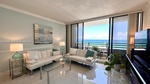 tiled living room with a textured ceiling and a wall of windows