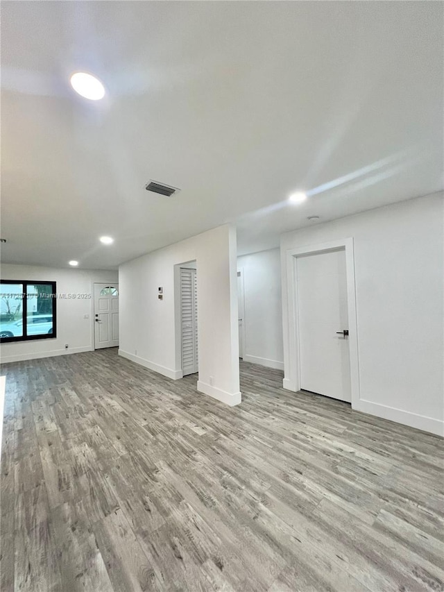 unfurnished living room featuring light wood-type flooring