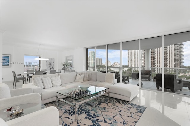 tiled living room featuring a wealth of natural light and expansive windows