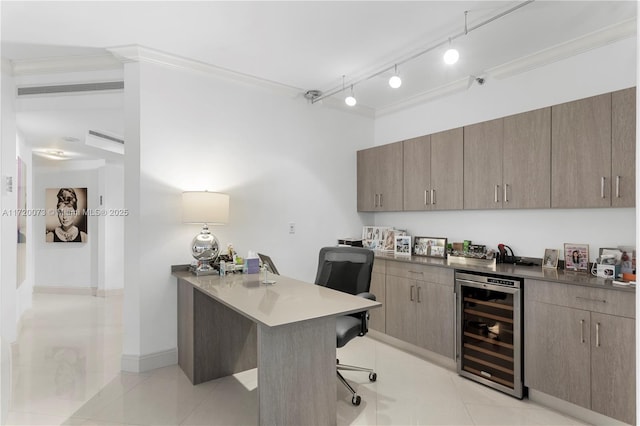 home office featuring ornamental molding, rail lighting, light tile patterned flooring, and wine cooler