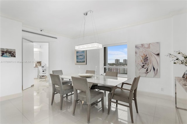 tiled dining room with ornamental molding