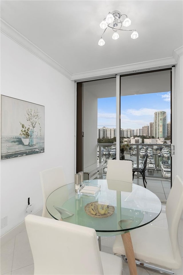 dining area featuring ornamental molding, a wall of windows, and light tile patterned floors