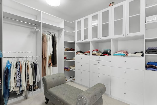 walk in closet featuring light tile patterned floors