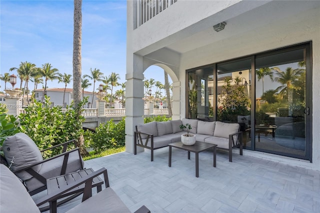 view of patio / terrace with a balcony and outdoor lounge area