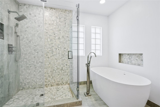 bathroom featuring plus walk in shower