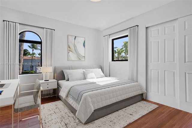 bedroom with hardwood / wood-style flooring