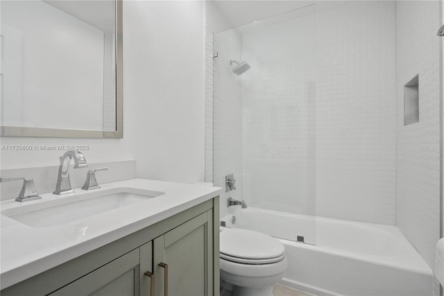 full bathroom featuring tub / shower combination, vanity, and toilet