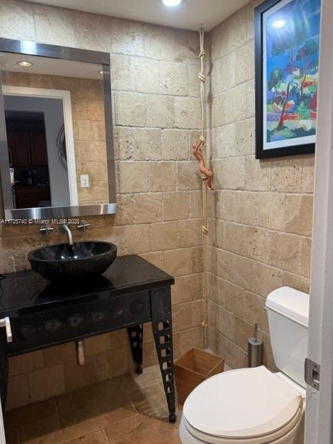 bathroom featuring sink and toilet