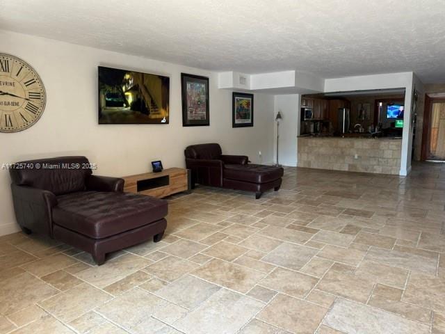 living room with a textured ceiling