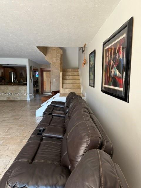 living room featuring a textured ceiling