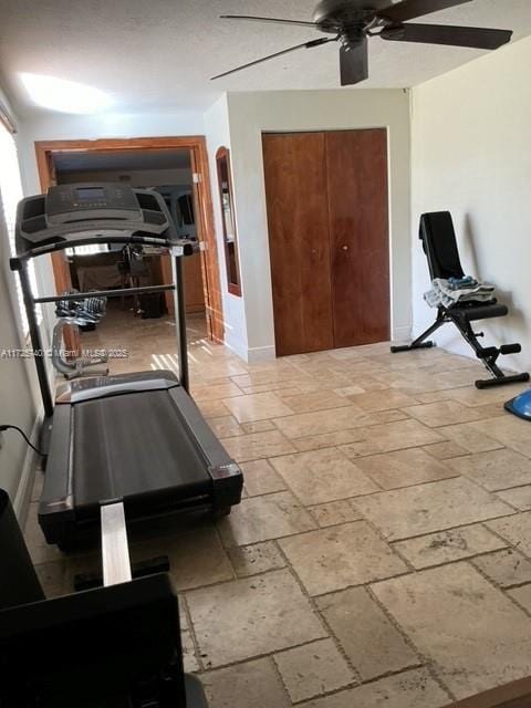 workout room with ceiling fan