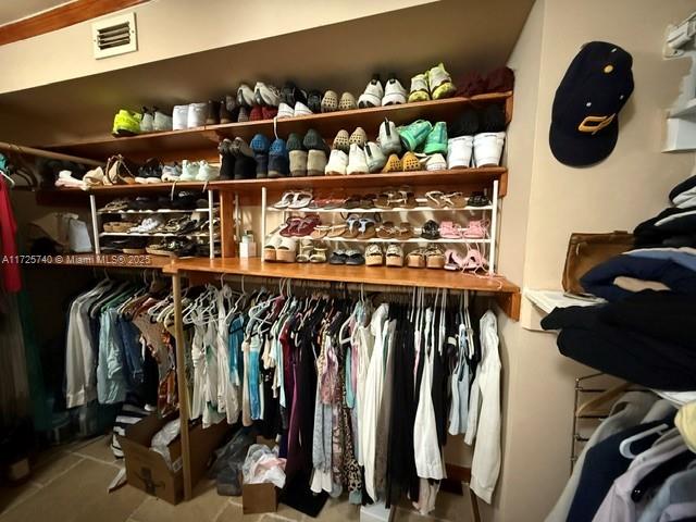 walk in closet featuring tile patterned flooring