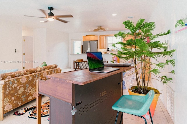 tiled home office with ceiling fan