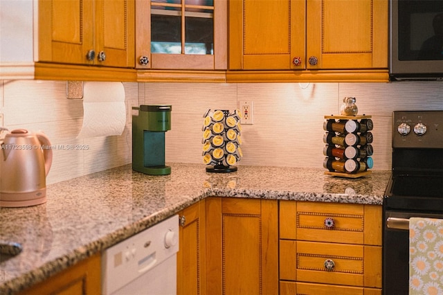 kitchen with light stone countertops, white dishwasher, tasteful backsplash, and electric stove