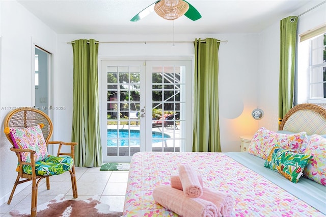 tiled bedroom featuring ceiling fan and french doors