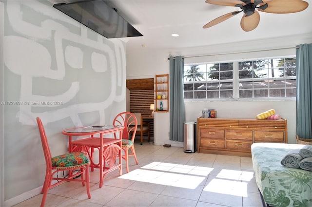 bedroom featuring light tile patterned floors and ceiling fan