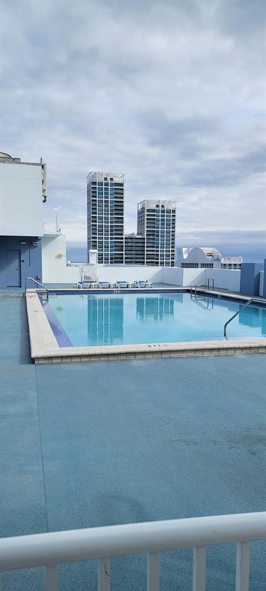 view of swimming pool with a patio area