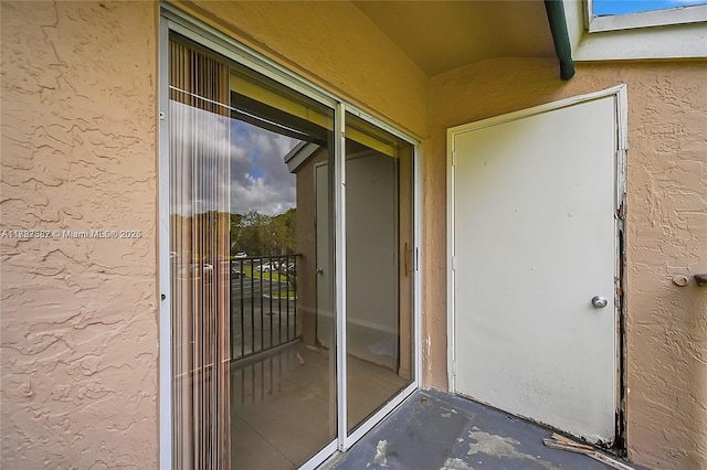 property entrance with a balcony