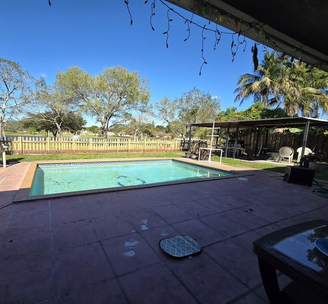 view of pool featuring a fenced in pool, a patio, and fence