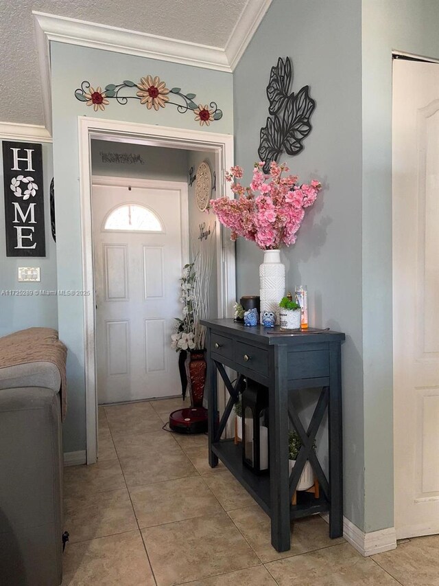 dining space with a textured ceiling, ceiling fan, and ornamental molding