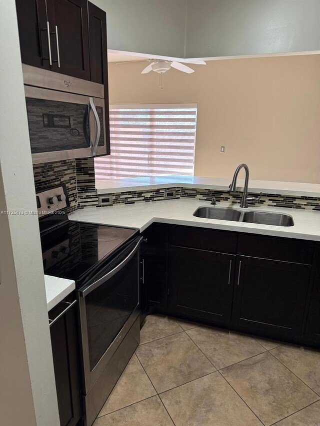 kitchen featuring stainless steel refrigerator with ice dispenser, a textured ceiling, and light tile patterned floors