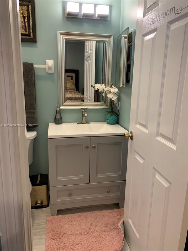 bathroom with vanity and toilet