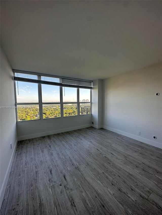 spare room with hardwood / wood-style flooring