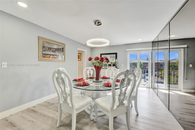 dining space featuring light hardwood / wood-style flooring