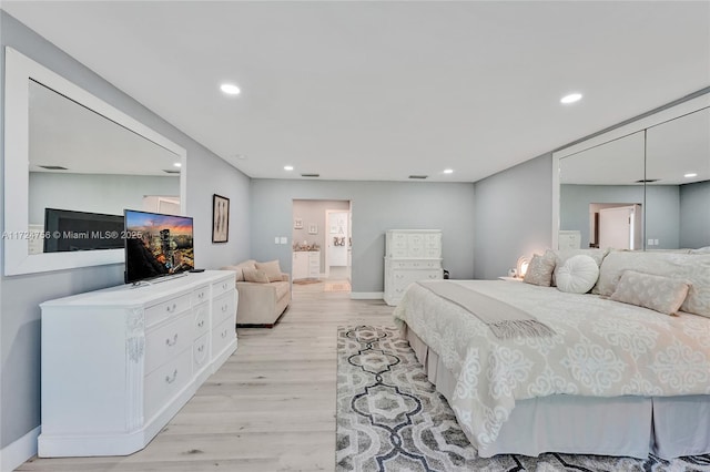 bedroom with light hardwood / wood-style floors