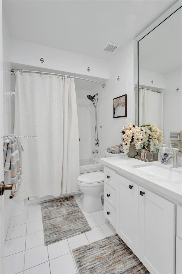 full bathroom with vanity, tile patterned floors, toilet, and shower / bathtub combination with curtain