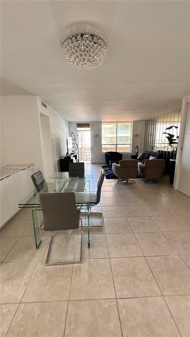 dining space featuring light tile patterned floors