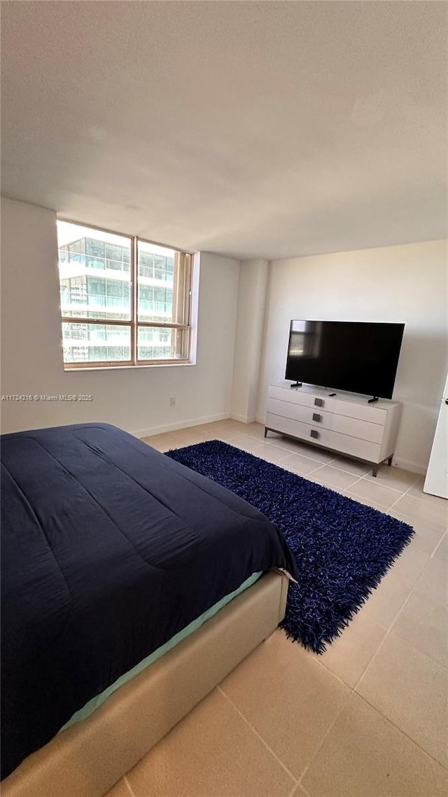 unfurnished bedroom with tile patterned floors