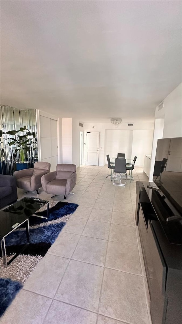 living room with light tile patterned floors