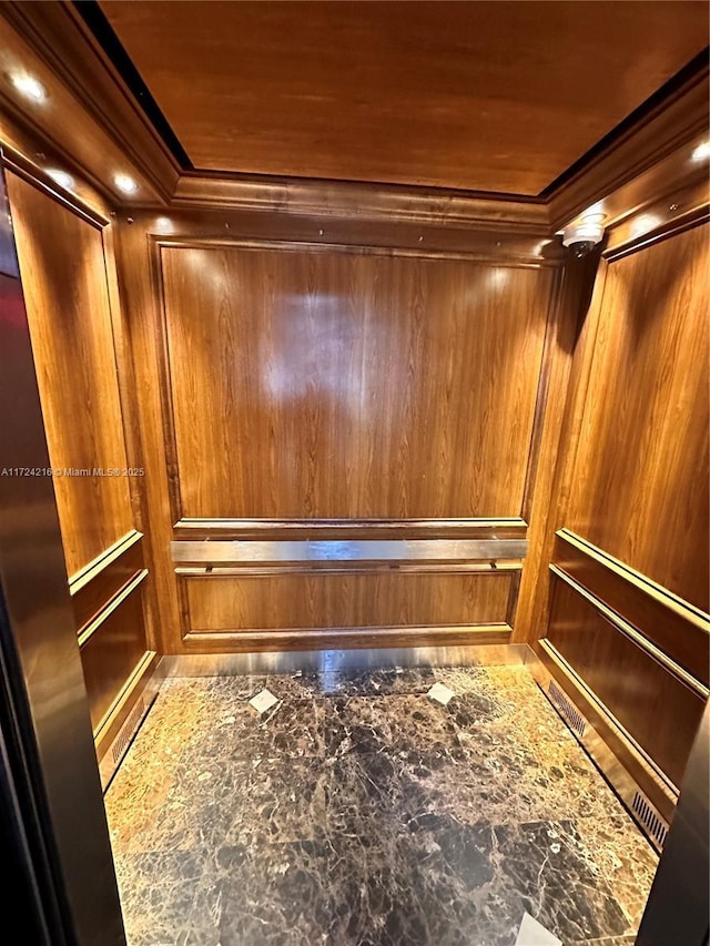 details with elevator and wood walls