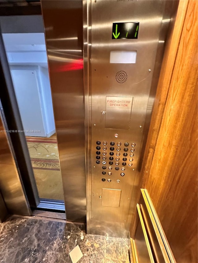 interior details featuring wood walls and elevator