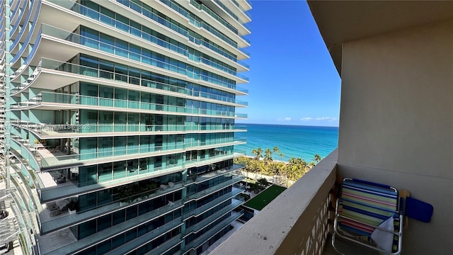 balcony featuring a water view