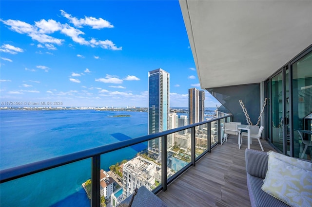 balcony featuring a water view