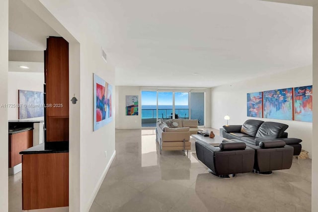 living room featuring a water view