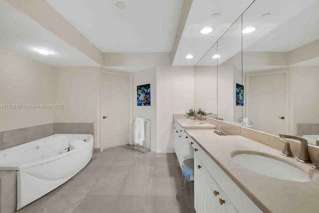 bathroom with vanity and a bathing tub