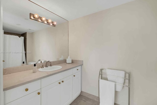 bathroom featuring tile patterned floors and vanity