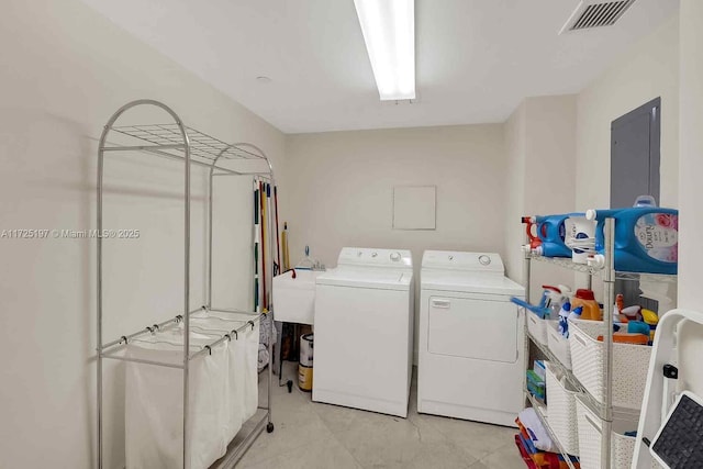 laundry room with sink and washer and dryer