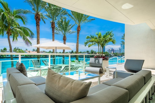 view of swimming pool featuring a water view and an outdoor hangout area