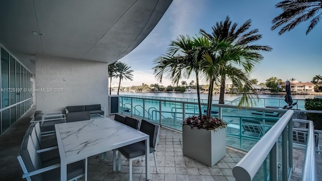 balcony at dusk with a water view