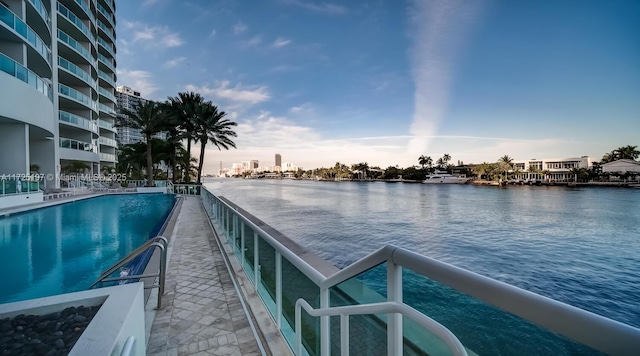 view of pool featuring a water view