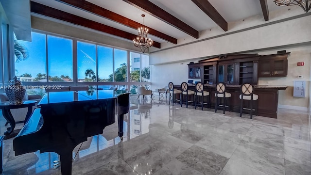 dining space featuring beam ceiling and an inviting chandelier