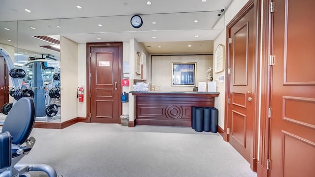 exercise area with light colored carpet