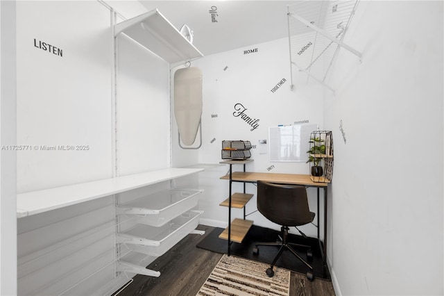 home office with dark wood-type flooring